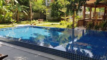 Outdoor pool, open 7:00 AM to 10:00 PM, sun loungers