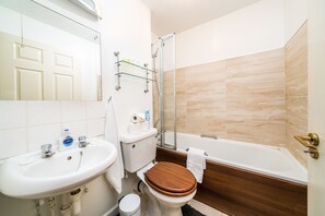 Combined shower/bathtub, hair dryer, towels, soap