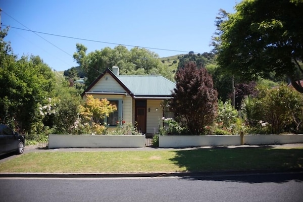 Welcoming house with wood burner, private deck, cottage garden and fast wifi.
