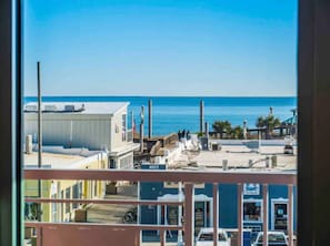 Enjoy breathtaking views of the coastal area from this balcony.