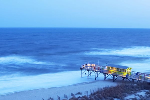 Stroll along the pier, taking in the serene ocean views and feeling the ocean breeze.