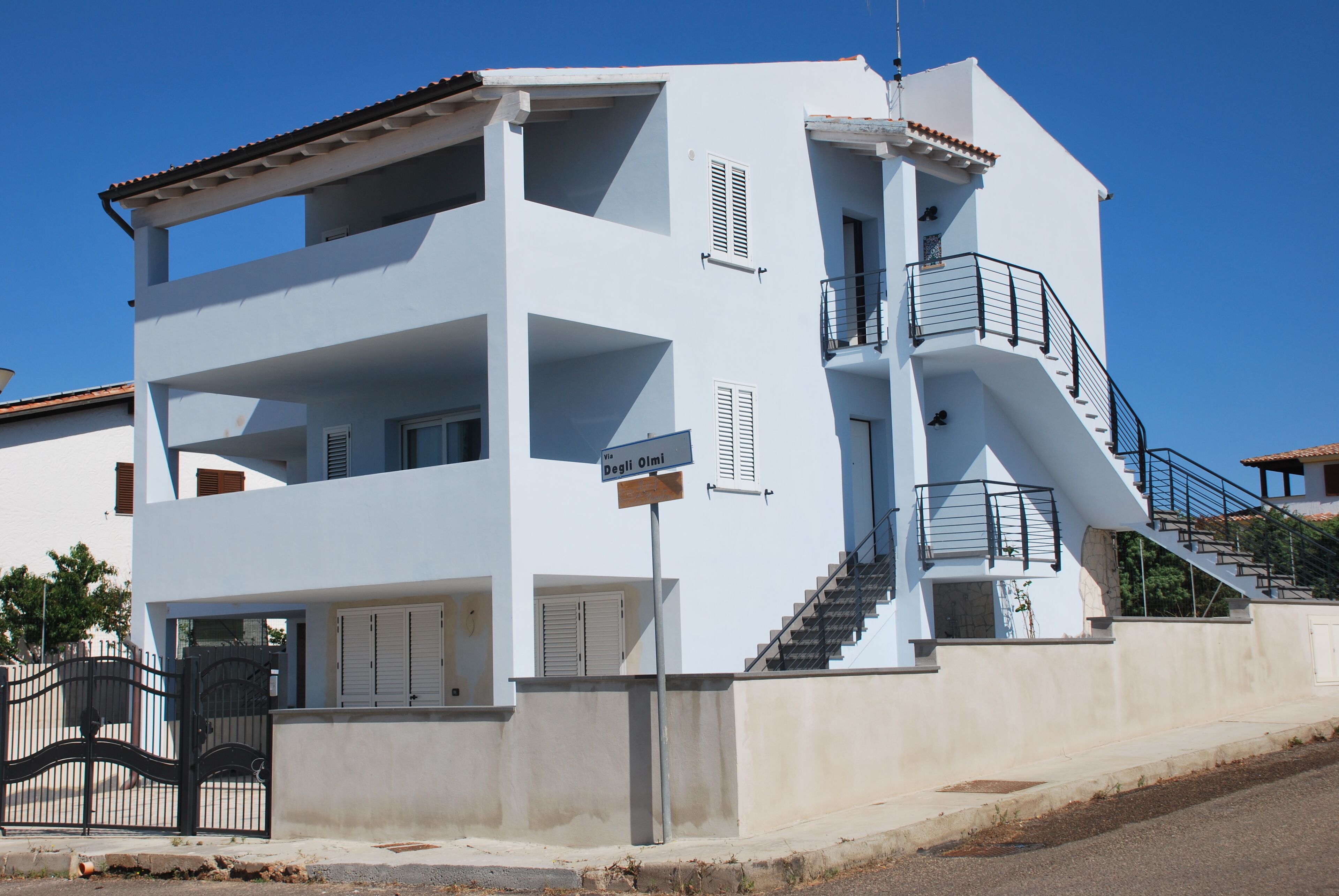 A multi-story building with a staircase and balconies.