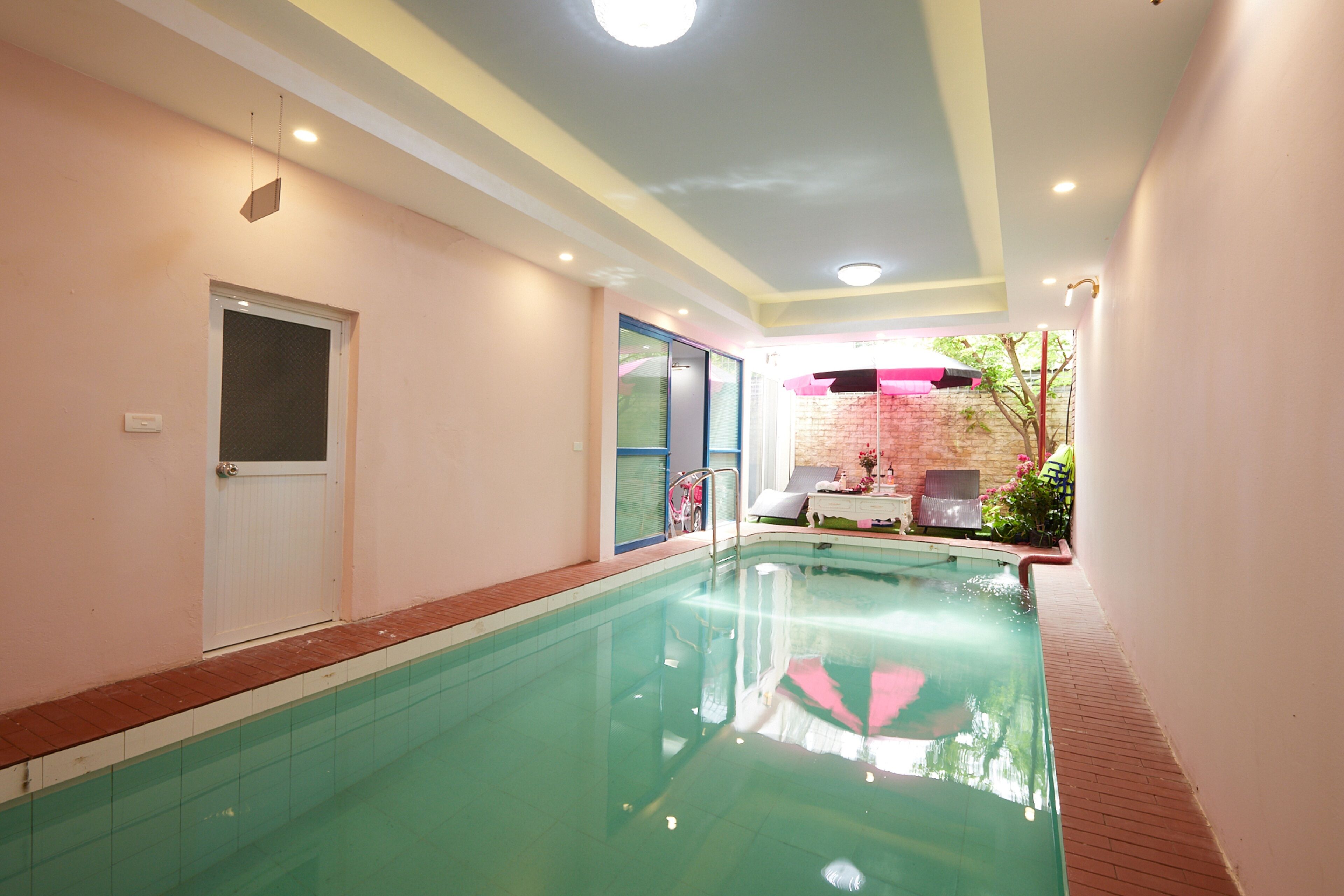 Indoor pool, pool umbrellas, pool loungers