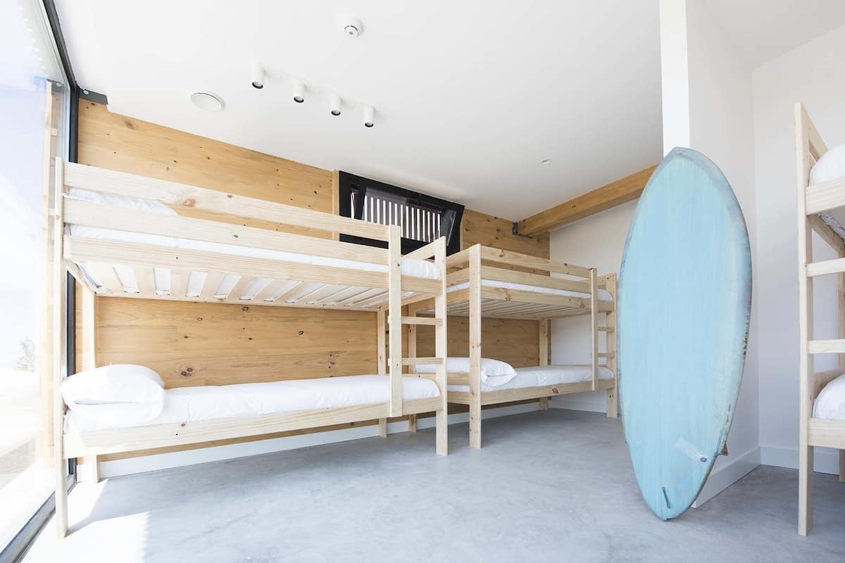 Pack: 1 bed in a 8-Bed Dorm Room, Mixed Dorm, Shared Bathroom + 2h Surf + 1h Yoga | Blackout drapes, free WiFi, bed sheets
