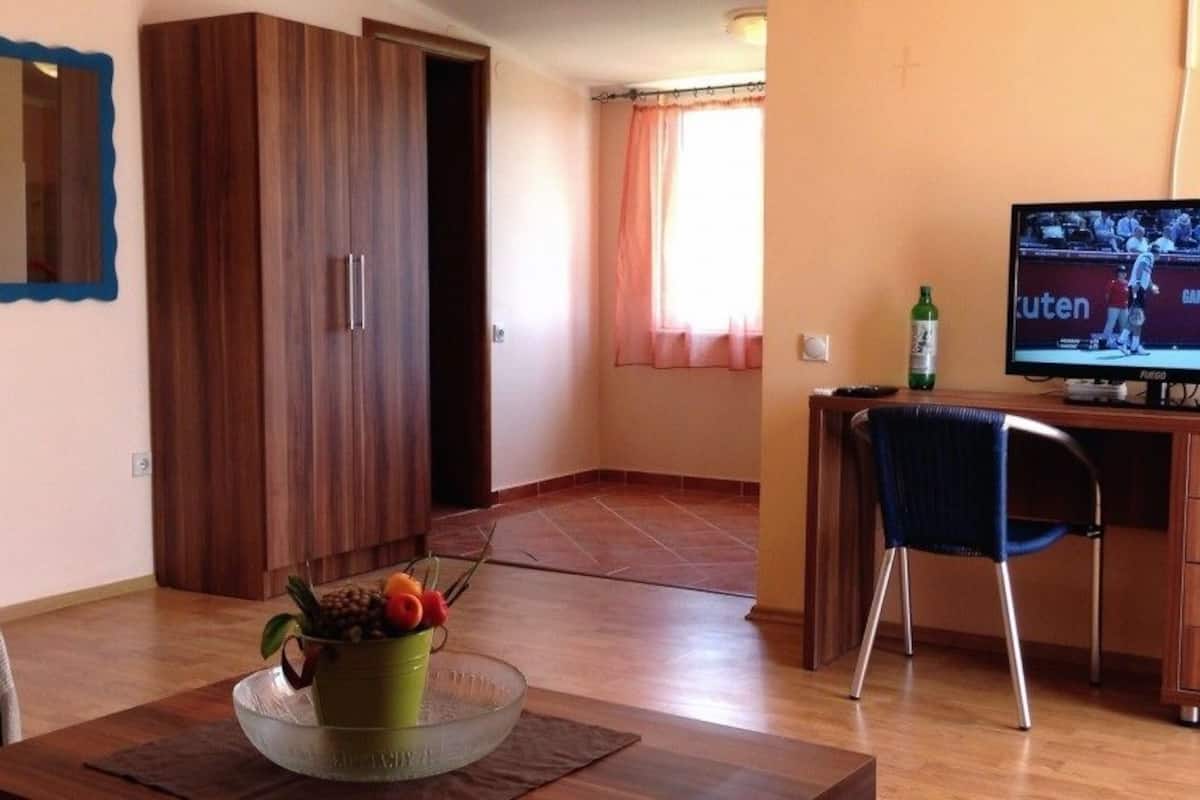 Family Apartment, Sea View, Sea Facing | Living area | Flat-screen TV