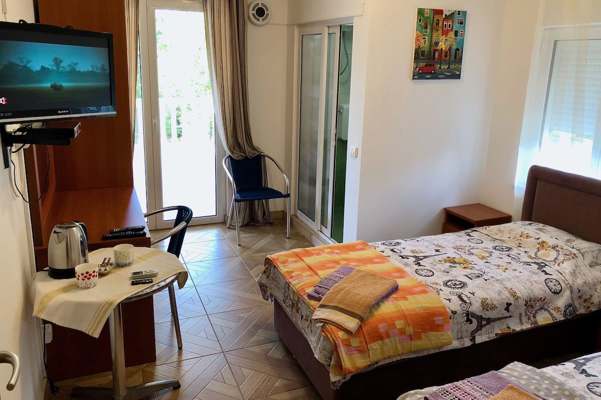 Superior Twin Room, Garden View | Minibar, desk, laptop workspace, blackout drapes