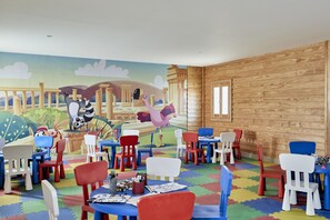 A children's playroom with colorful furniture and a mural on the wall. - JAZ Elite Maraya - All inclusive (El Quseir)