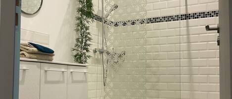 Superior Triple Room, Courtyard View | Bathroom | Shower, eco-friendly toiletries, hair dryer, towels