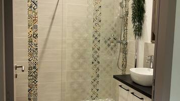 Superior Quadruple Room, Courtyard View | Bathroom | Shower, hair dryer, towels, soap