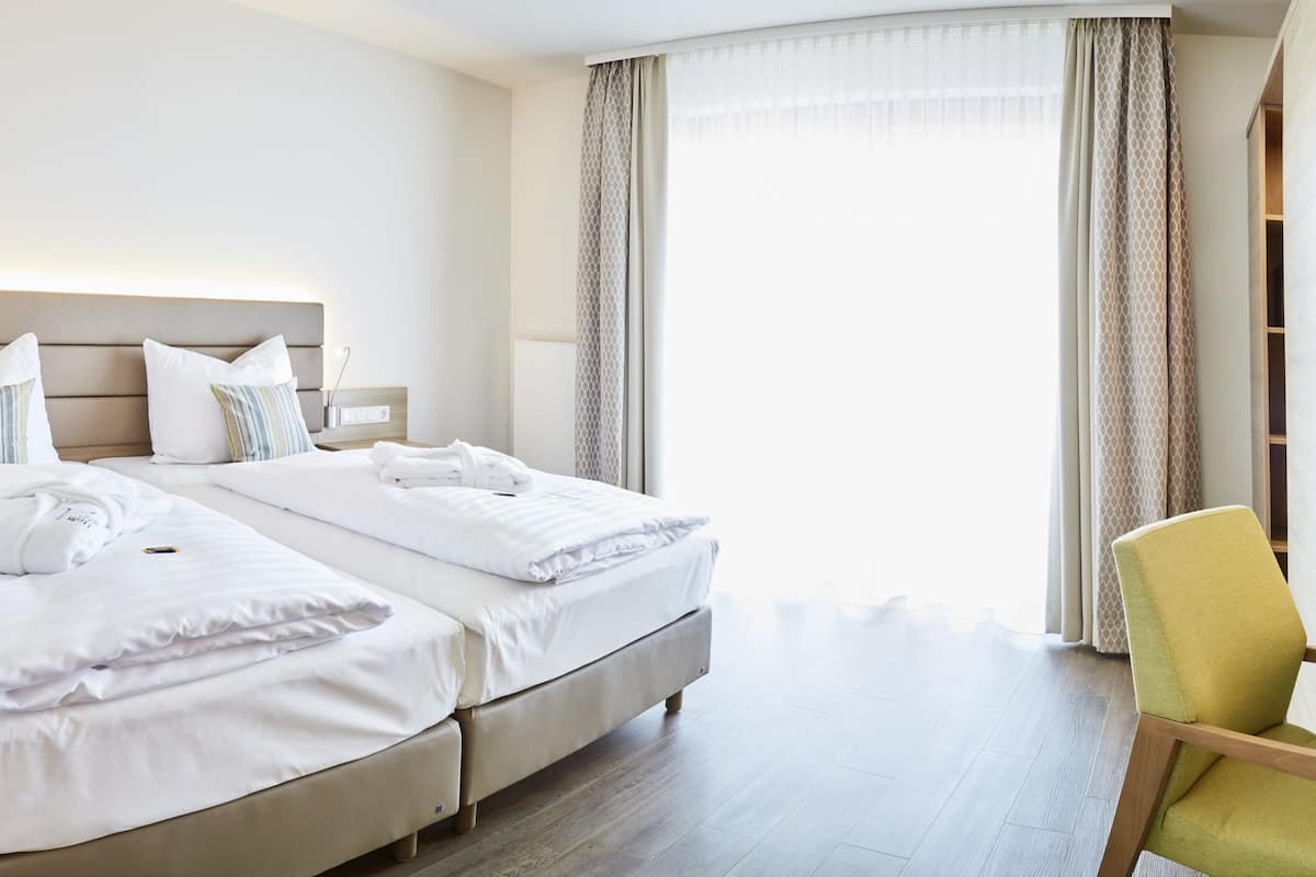 hypo-allergenic bedding, in-room safe, desk, blackout curtains