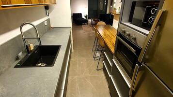 Design Apartment, Multiple Beds | Private kitchen