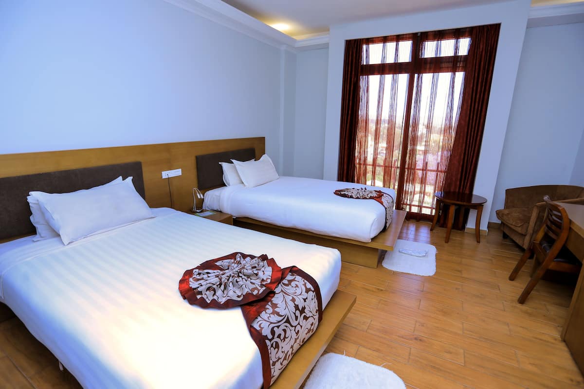 standard twin room | premium bedding, laptop workspace, iron/ironing board, rollaway beds