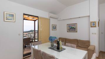 Apartment, 2 Bedrooms, Balcony, Sea View | Living area | Flat-screen TV