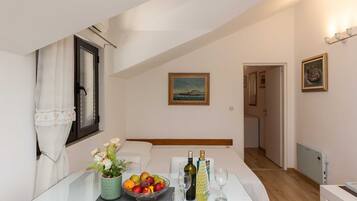 Apartment, 1 Bedroom, Patio, Sea View | Living area | Flat-screen TV