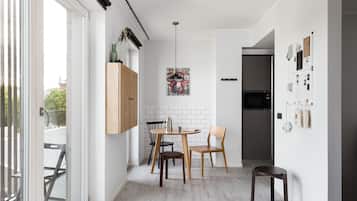 Spacious Studio Home with Terrace | Living area | 43-inch flat-screen TV with cable channels, LCD TV, video-game console