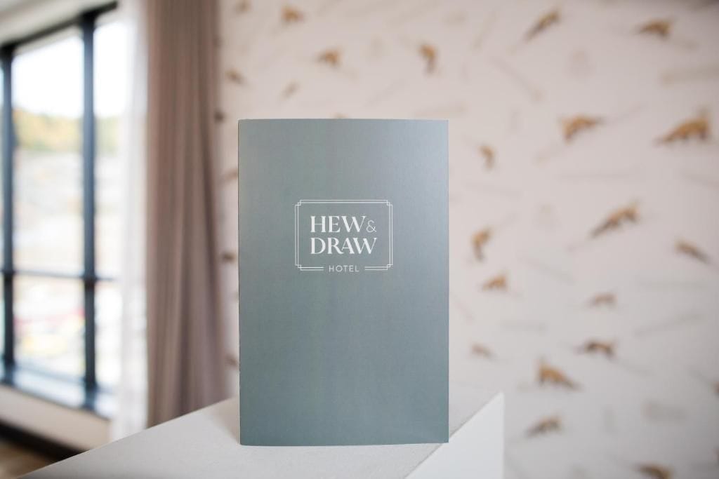 A brochure for HEW& DRAW HOTEL with a simple design.