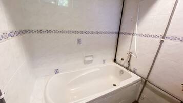 Family Apartment, Pool View | Bathroom | Separate tub and shower, deep soaking tub, slippers, towels