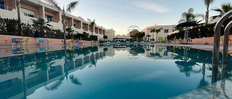 Outdoor pool, pool umbrellas, sun loungers