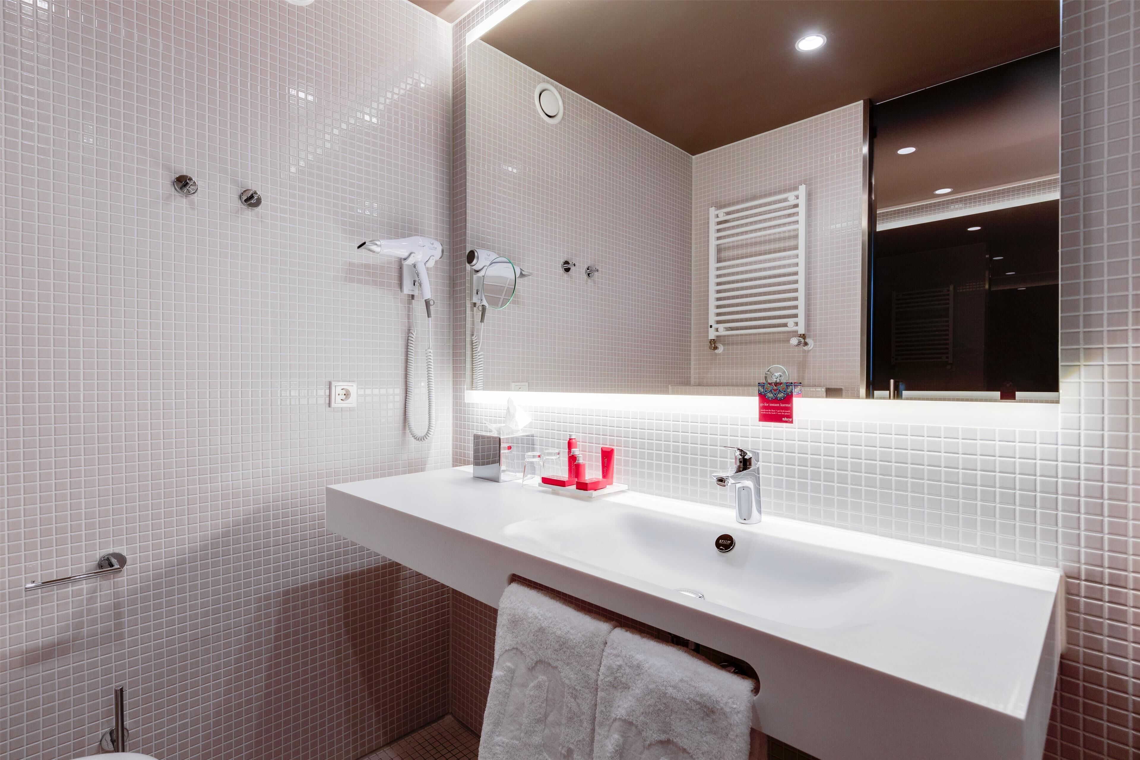 eco-friendly toiletries, hair dryer, towels, soap