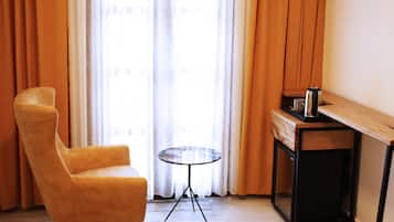 Luxury Room | Living area | 42-inch LED TV with satellite channels, TV, heated floors