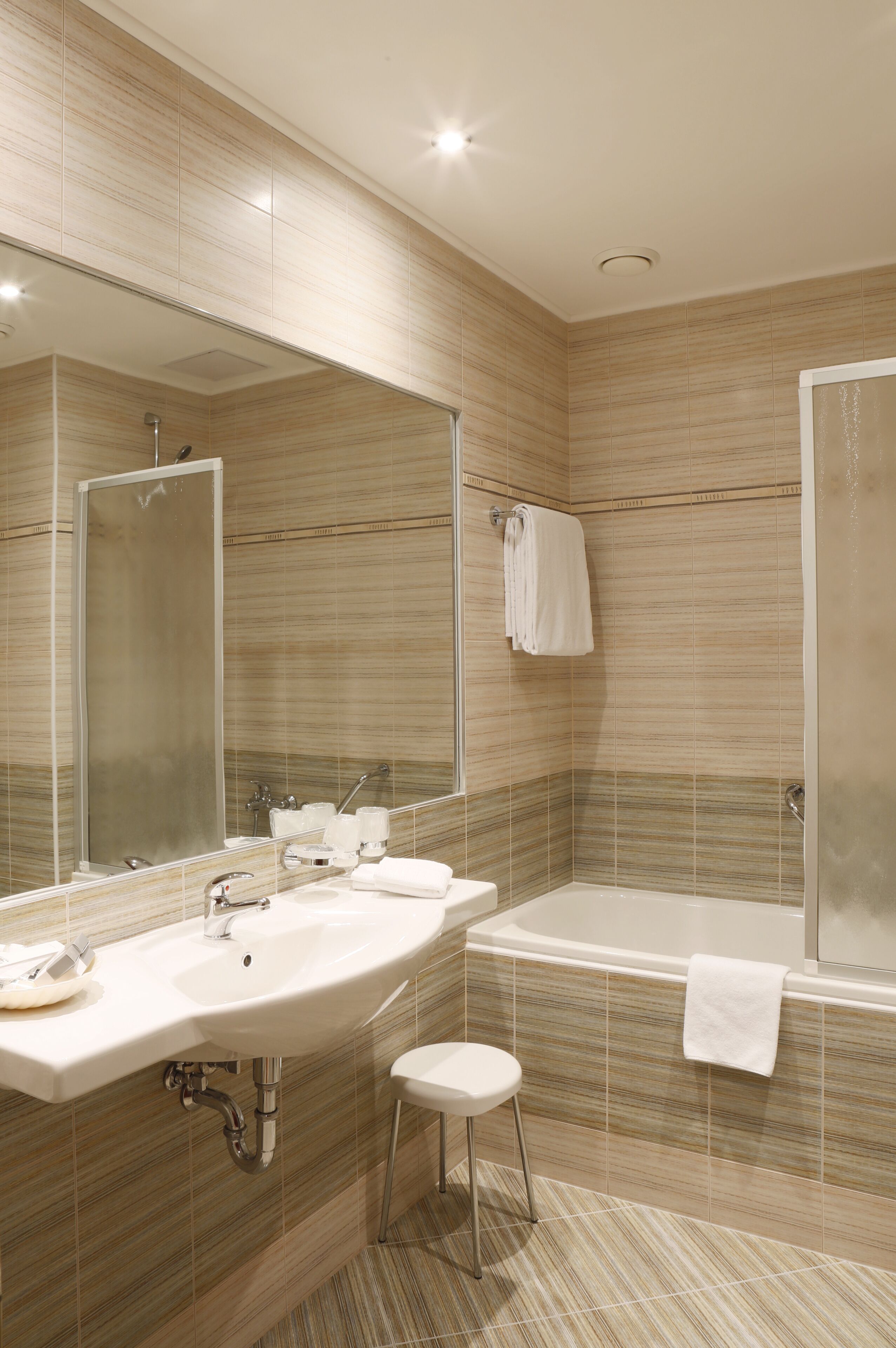Designer toiletries, hair dryer, bathrobes, slippers