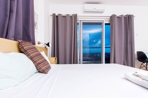 In-room safe, desk, laptop workspace, blackout drapes - Royalty Apartments (Accra)