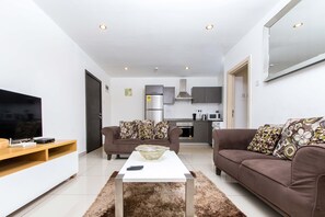 50-inch TV with satellite channels - Royalty Apartments (Accra)