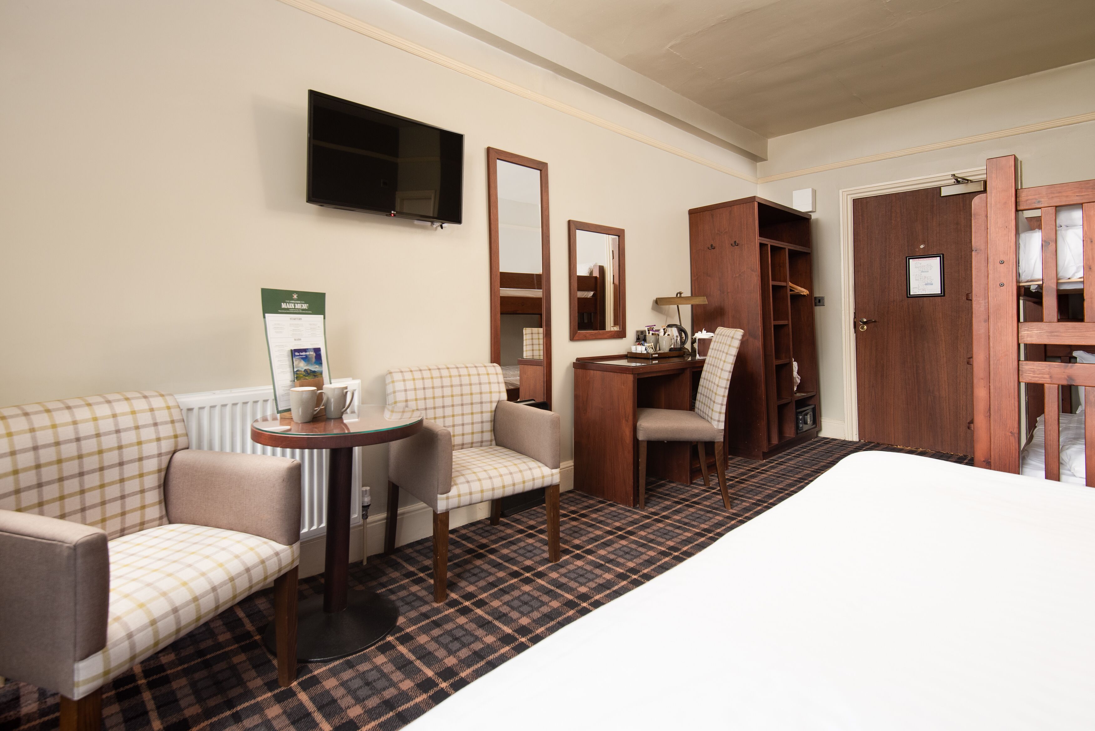 family room | 1 bedroom, in-room safe, desk, iron/ironing board