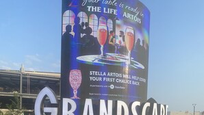 A large outdoor sign for "GRANDSCPACE" with a digital display advertising "Stella Artois" and a partnership with OpenTable. - Holiday Inn Express & Suites Plano - The Colony by IHG (The Colony)