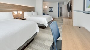 A hotel room with two beds, a desk, a chair, a TV, and a framed picture on the wall. - Holiday Inn Express & Suites Plano - The Colony by IHG (The Colony)
