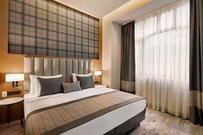 Biancheria da letto di alta qualità, minibar, cassaforte in camera