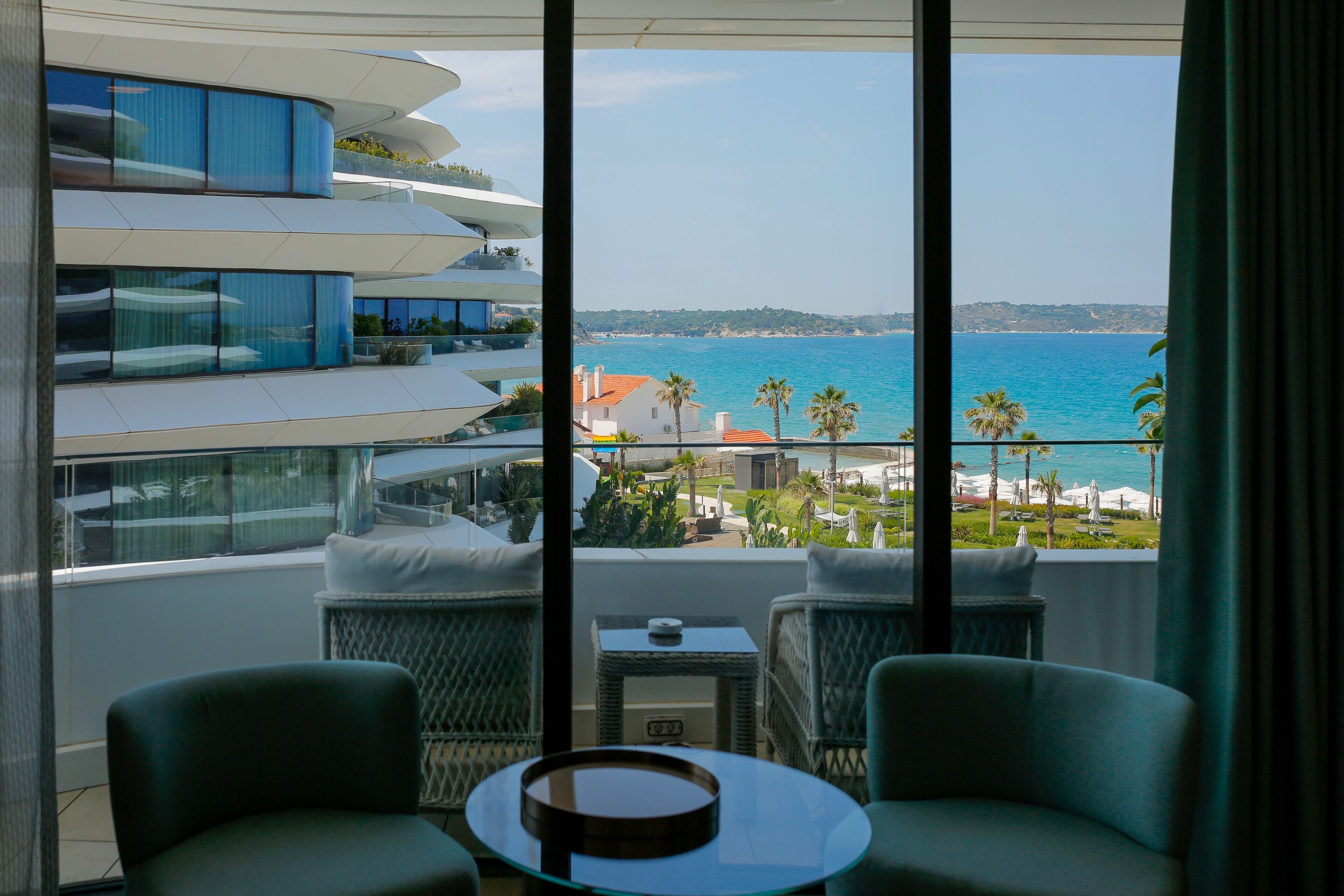 room, 1 king bed, sea view, corner | living area | 55-inch smart tv with satellite channels, tv