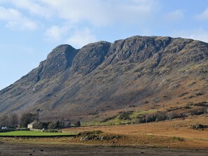 A mountainous landscape with a clear sky.