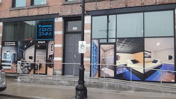 Zens Inn features a modern exterior with a large digital sign and a welcoming entrance.