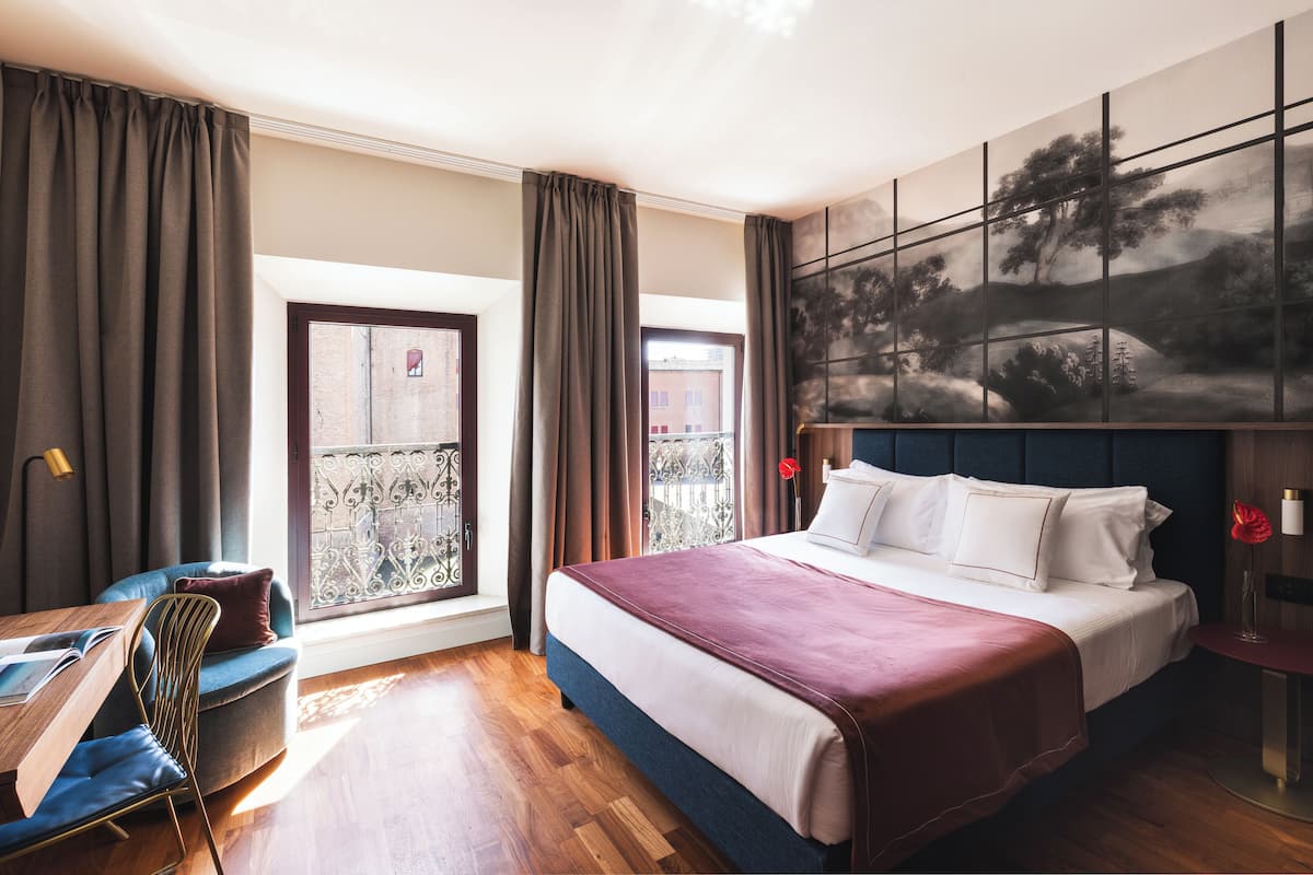 Superior kamer | 1 slaapkamer, een minibar, een kluis op de kamer, een bureau