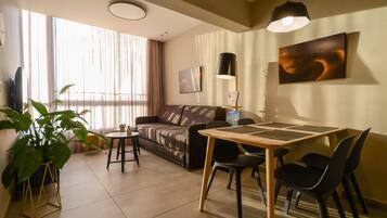 Luxury Apartment, Sea View | Living area | 65-inch Smart TV with premium channels, TV, Netflix