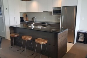 Fridge, microwave, oven, stovetop - Modern Riverside Apartment - Stunning views (Taupo)