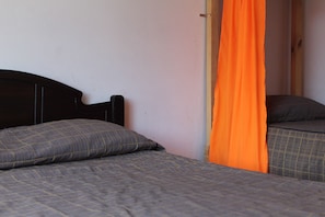 Basic Triple Room, Courtyard View | In-room safe, blackout drapes