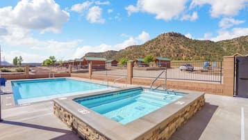 Seasonal outdoor pool, open 9:00 AM to 10:00 PM, pool loungers