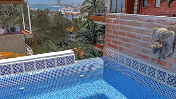 Outdoor pool, open 10:00 AM to 10:00 PM, sun loungers