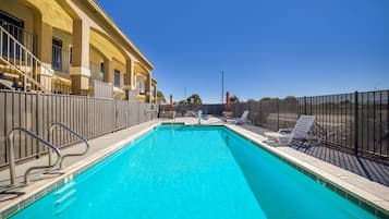 Outdoor pool, open 9:00 AM to 9:00 PM, pool umbrellas