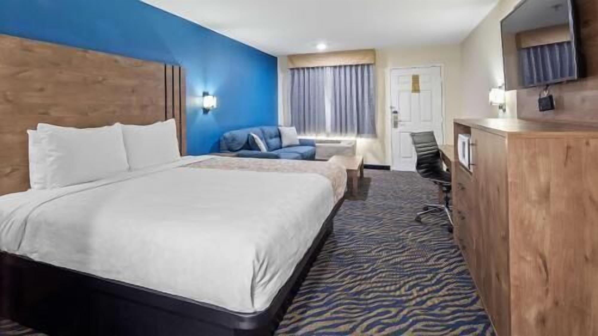 Premium bedding, desk, laptop workspace, soundproofing