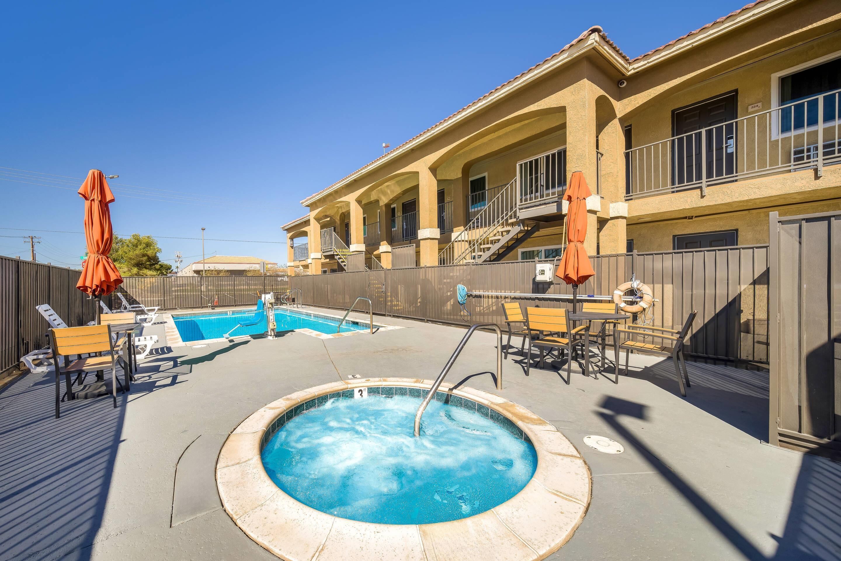 Outdoor pool, open 9:00 AM to 9:00 PM, pool umbrellas