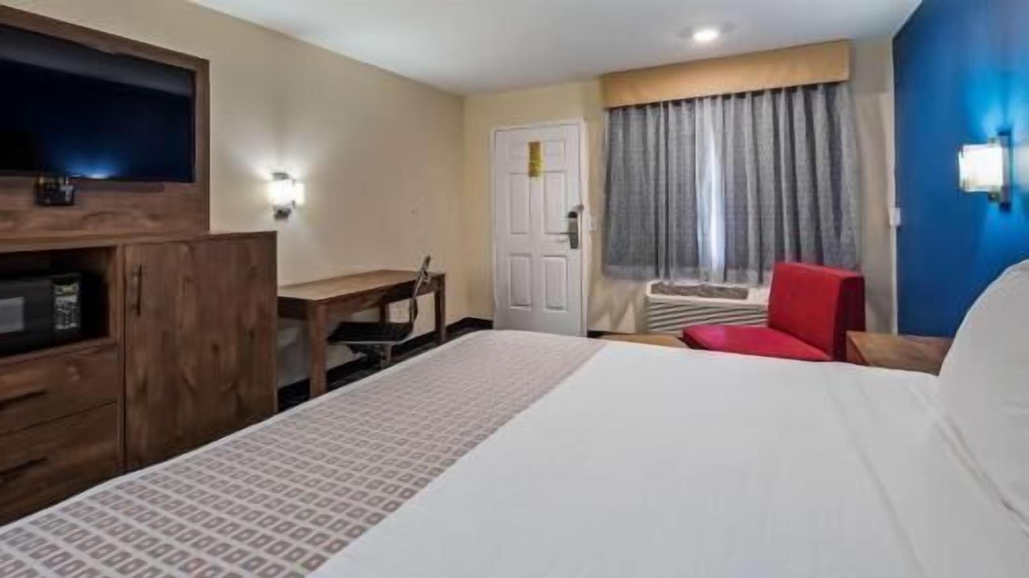 Premium bedding, desk, laptop workspace, soundproofing