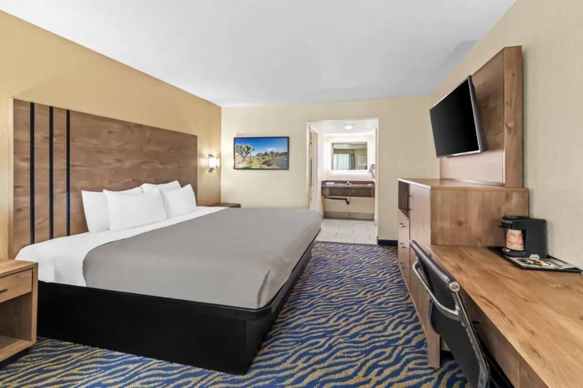 Premium bedding, desk, laptop workspace, soundproofing