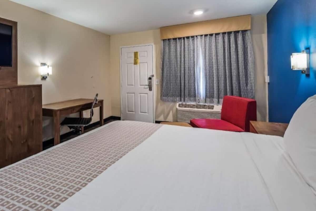 Premium bedding, desk, laptop workspace, soundproofing