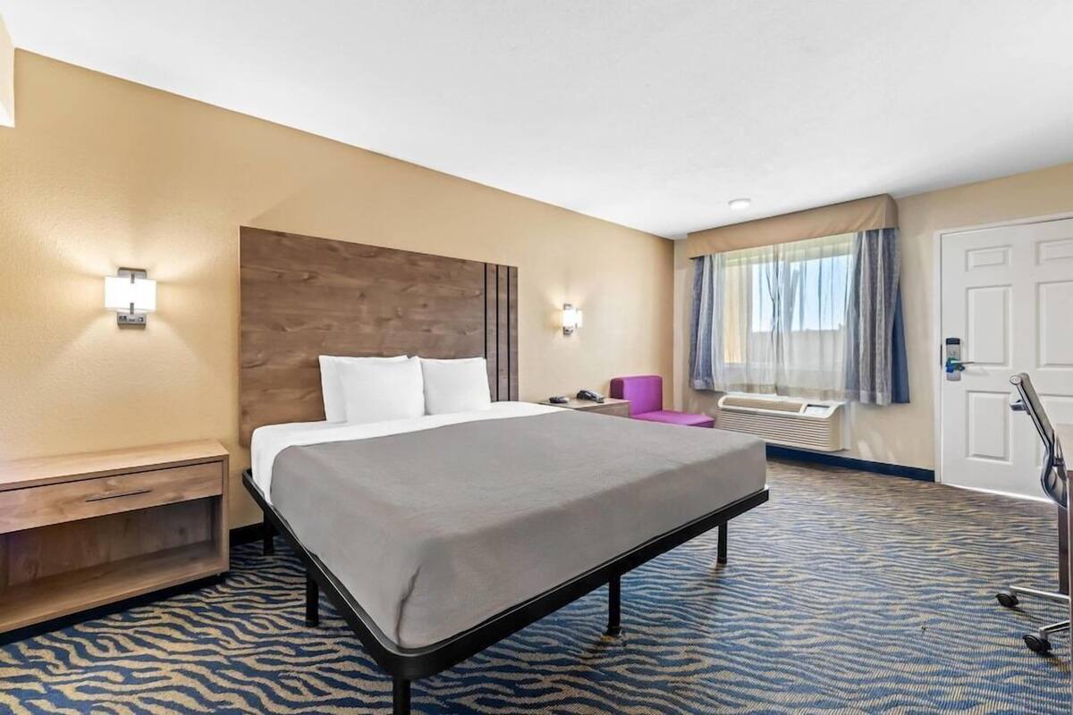 Premium bedding, desk, laptop workspace, soundproofing