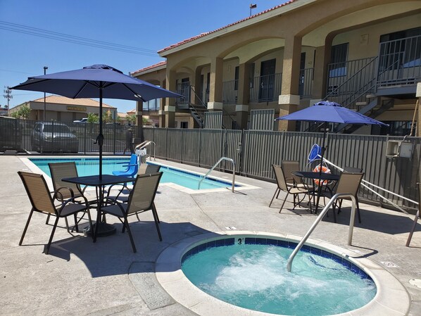 Outdoor pool, open 9:00 AM to 9:00 PM, pool umbrellas