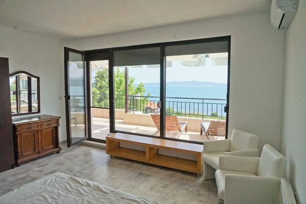 2nd bedroom with double bed and balcony June 2025