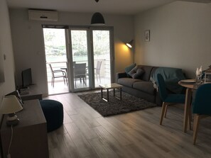 Newly decorated living area through to spacious balcony. 